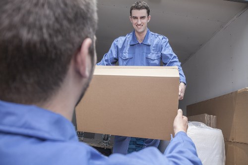 House moving team working in a West Harrow residential street
