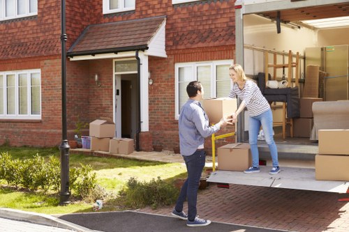Removal van and movers planning access near a West Harrow property