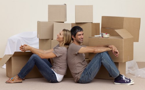 Packed boxes and furniture ready for a home move in West Harrow