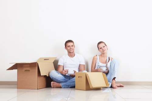 Local home movers arranging items in a new West Harrow home