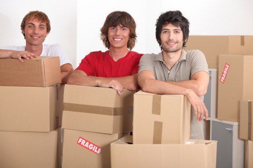 Packed boxes and furniture ready for a domestic removal in West Harrow