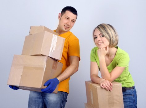 Packed boxes and furniture ready for transport in West Harrow