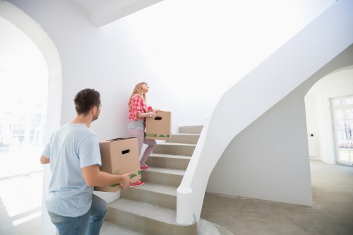 Packed boxes and furniture ready for transport during a West Harrow removal
