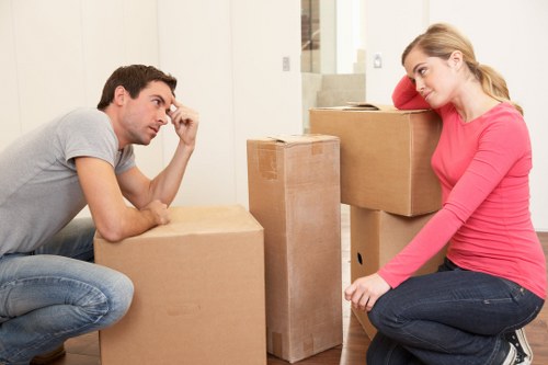 Professional movers handling boxes and furniture in West Harrow