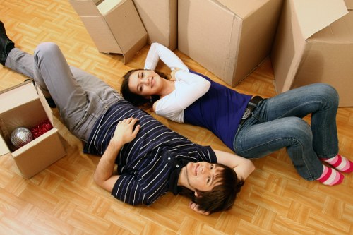 Professional man with van service handling household items in Westharrow